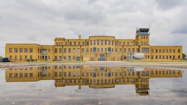 Overcast exteropr view of the Aviation Museum with reflection