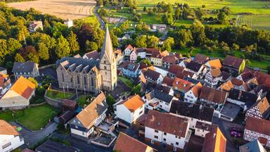 Aerial view of the houses and green spaces of town Schotten, Hesse, Germany on a sunny day