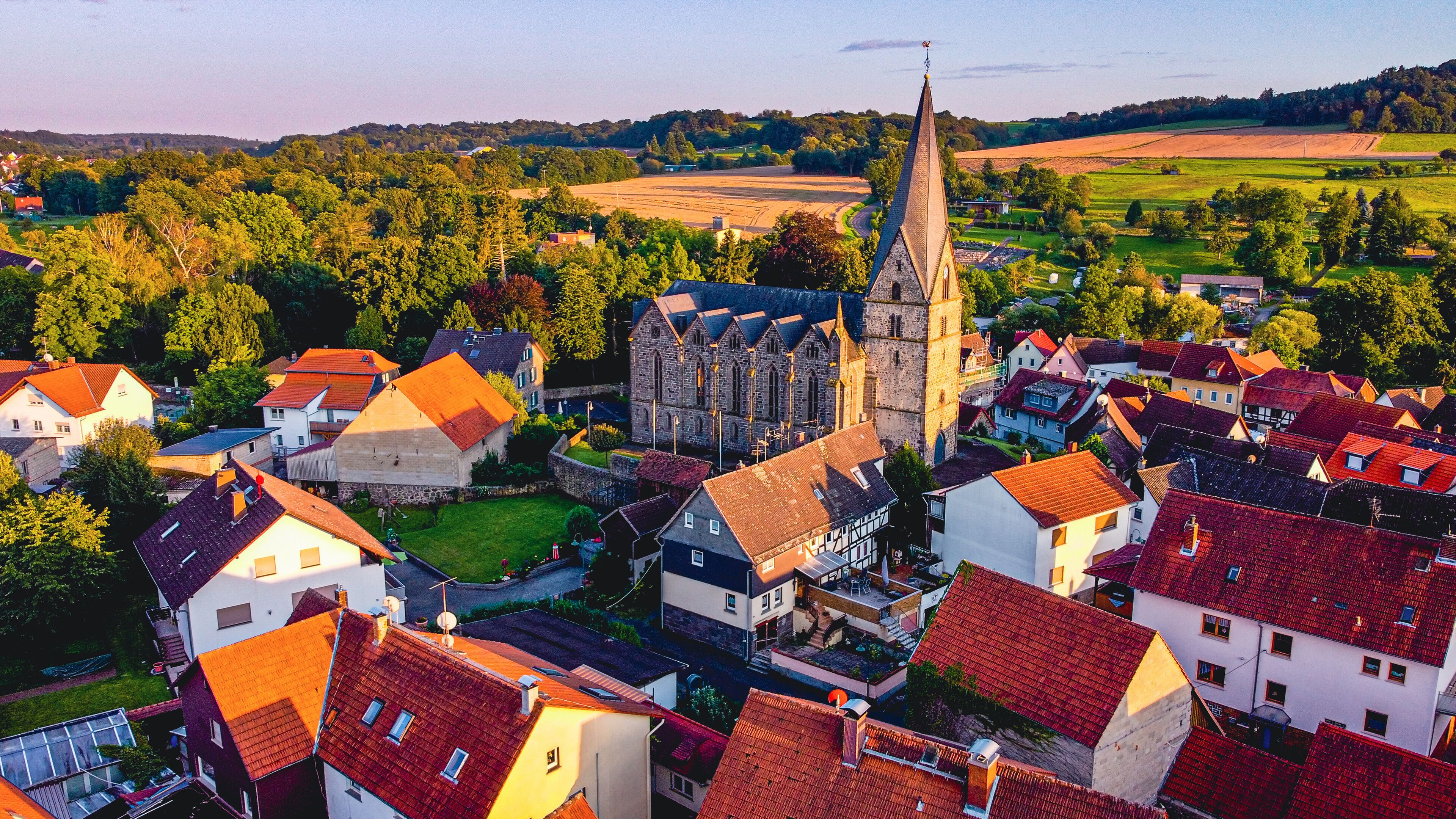 Aerial view of the houses and green spaces of town Schotten, Hesse, Germany on a sunny day