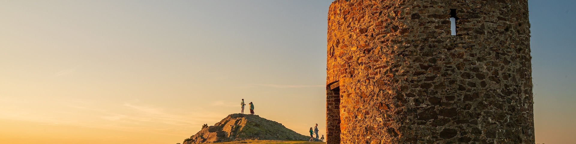 Enniscorthy which includes building ruins, a sunset and tranquil scenes