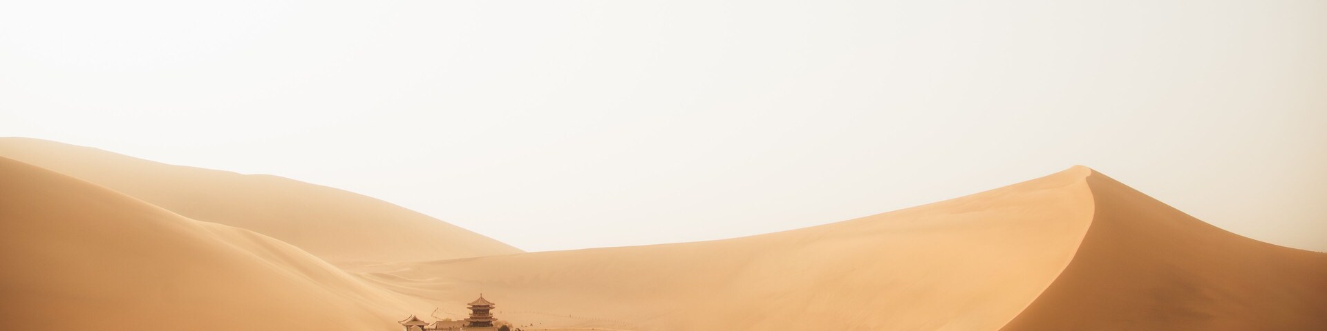 Mingsha Mountain and Crescent Lake in Dunhuang, Gansu Province - Desert scenery under clear sky
