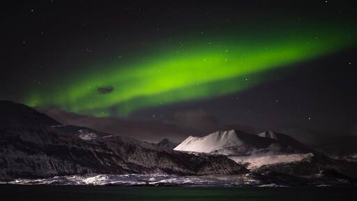 2 hours east of Tromso in the Arctic Circle. This is one of the best places to go to chase the Northern Lights. #northernlights #lights #auroraborealis #skibotn #norway #lifeatexpedia