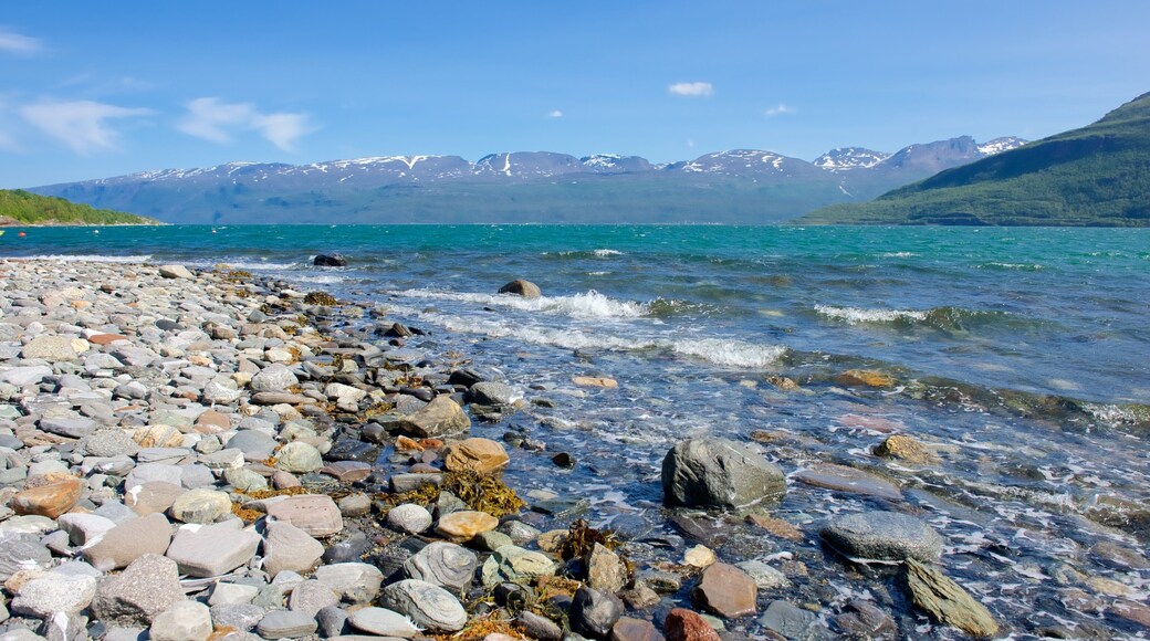 Storfjord which includes mountains, a pebble beach and a lake or waterhole