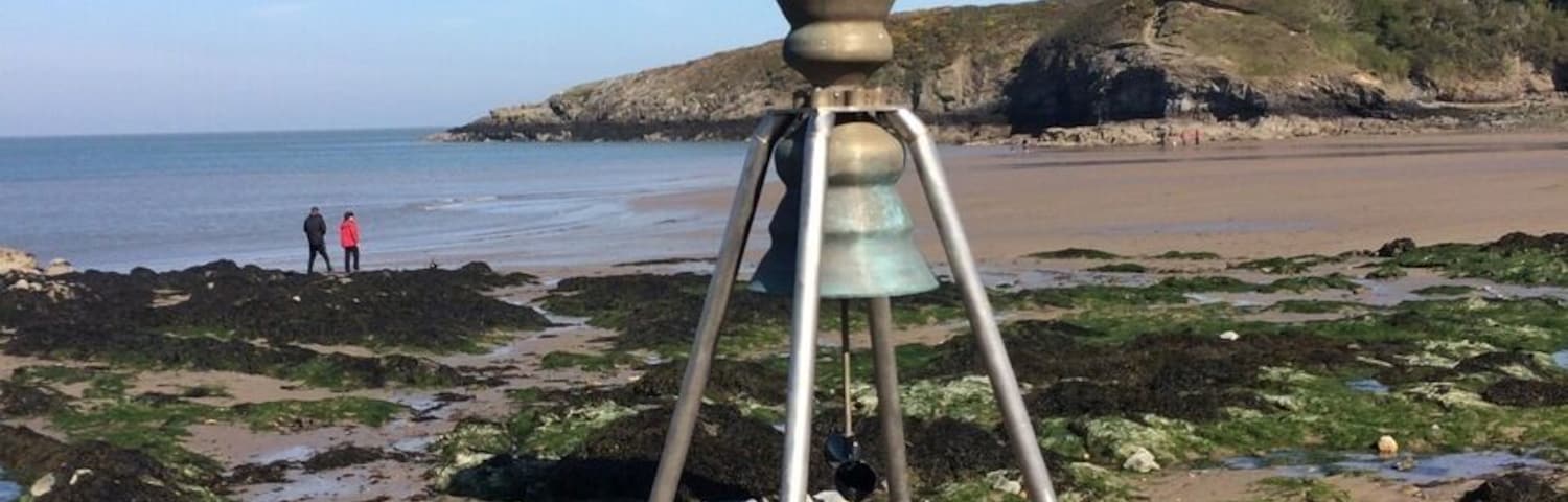 Tidal bell. The incoming tide rings the bronze bell.