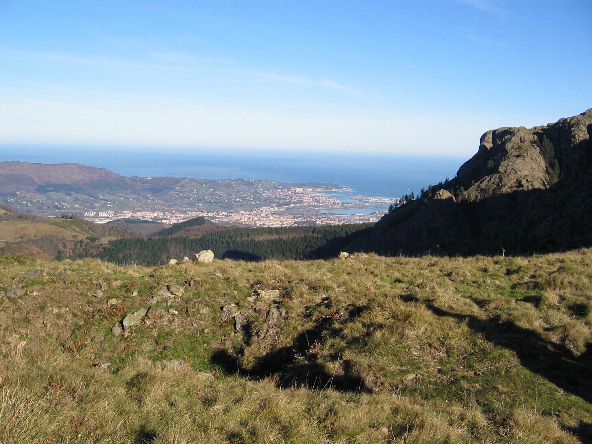 Overview of Irun, Hondarribia and a tip of Hendaia from Aiako Harria, with the Bay of Biscay in the background