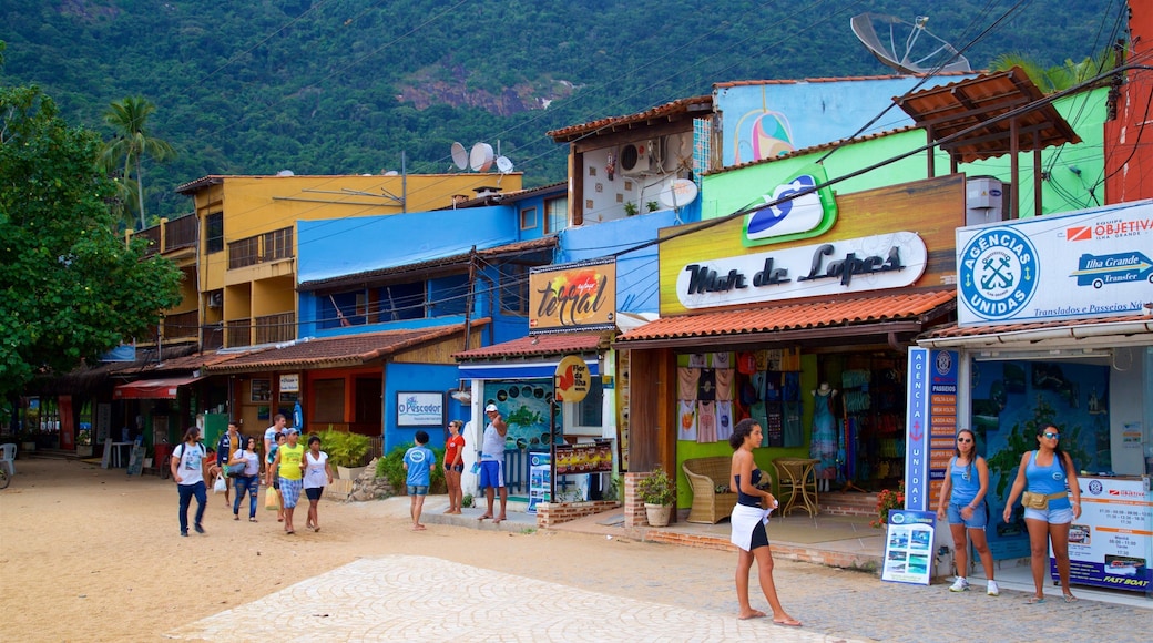 Vila do Abraao showing a small town or village and street scenes as well as a small group of people