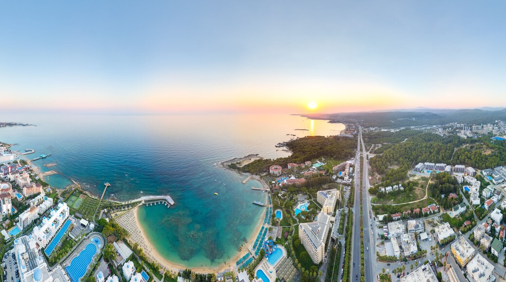 Avsallar, Alanya, Turkey. Cylindrical sunset panorama over D400 highway, panoramic views of coastal town, resort hotels, sandy beaches and Mediterranean bay. Panorama 360. Aerial view