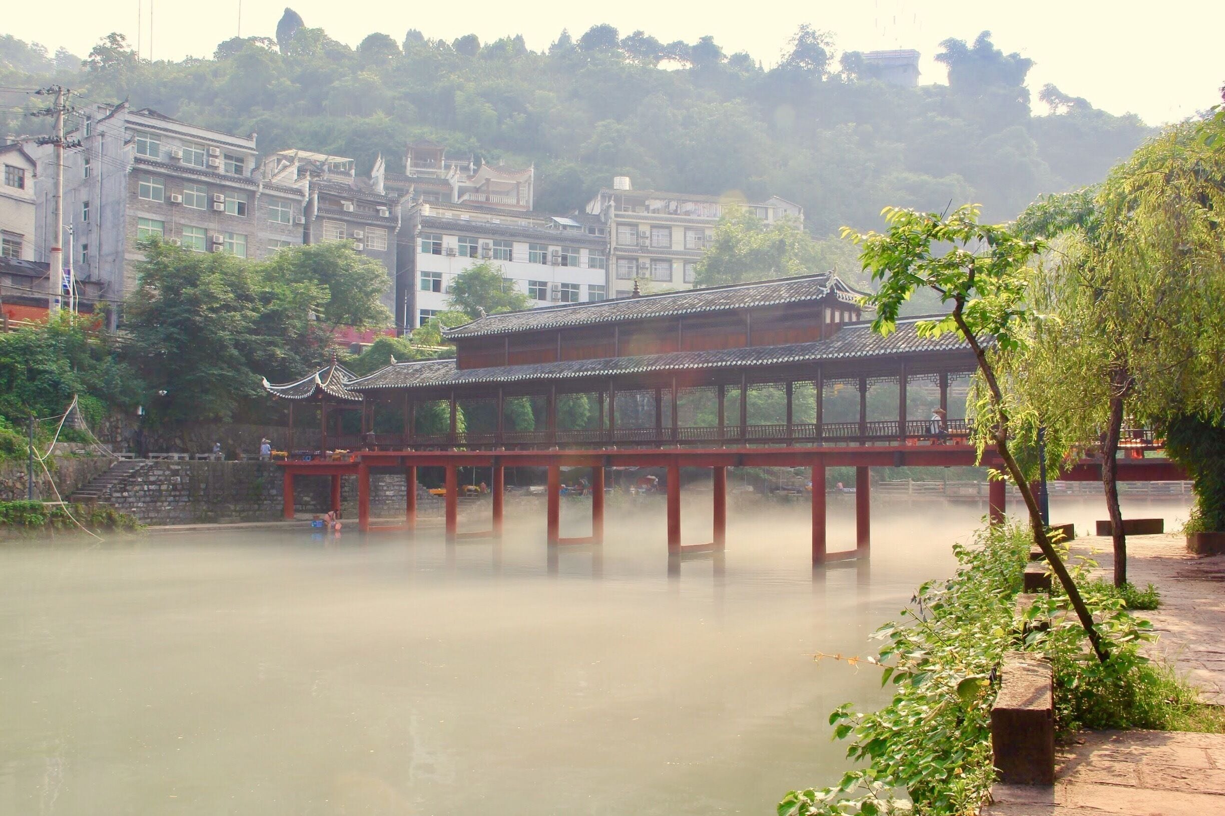 The Phoenix city totally covered in mist - early in the morning we went for a walk around the city and amazed by the city in mist. 

#ancient #china #Asia #red #nationalpark #hiking #water #architecture #travel 