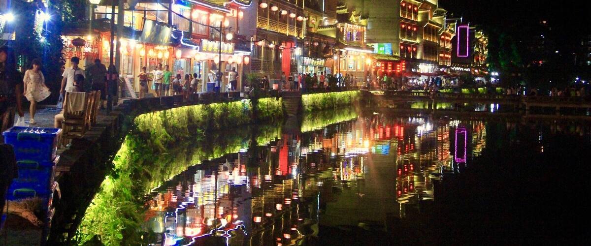 Night at the Phoenix City comes alive with bars, pubs, shops and restaurants busy with locals and tourists #china #landscape #nature #reflections #travel #nationalpark #hiking
