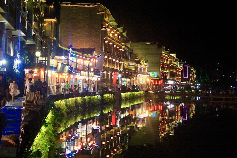 Night at the Phoenix City comes alive with bars, pubs, shops and restaurants busy with locals and tourists #china #landscape #nature #reflections #travel #nationalpark #hiking