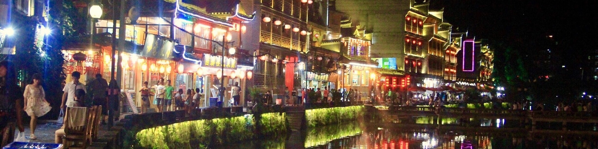Night at the Phoenix City comes alive with bars, pubs, shops and restaurants busy with locals and tourists #china #landscape #nature #reflections #travel #nationalpark #hiking
