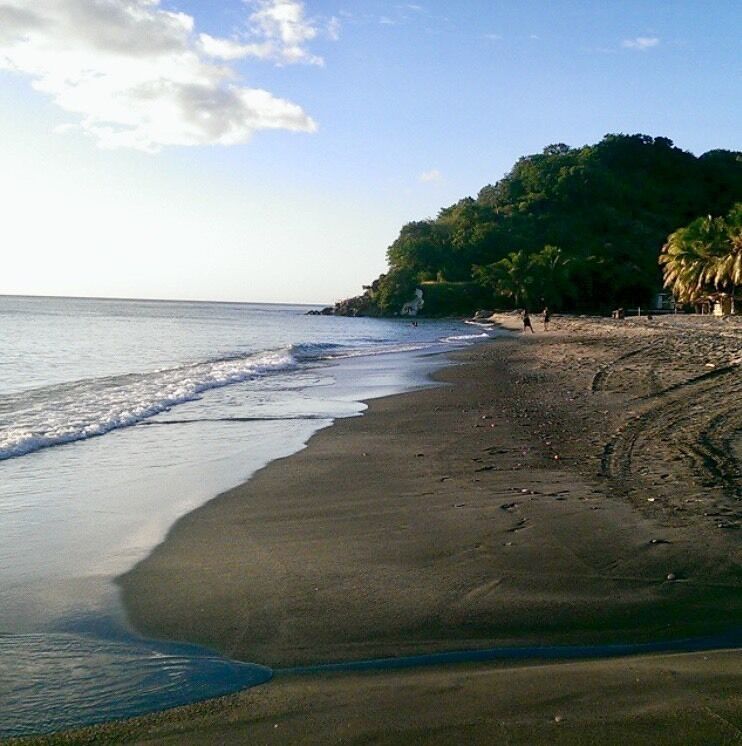 Beautiful black sand beach in Dominica the beach bar sells very fresh fried dolphin fish and bakes. Black sand feels so different from the white one it’s so soft and has bigger granules.