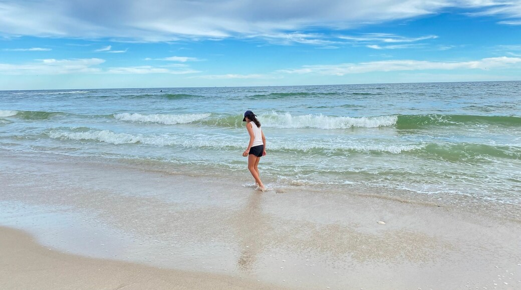 Rear shot of a girl having fun in the sandy Long Island beach, New York