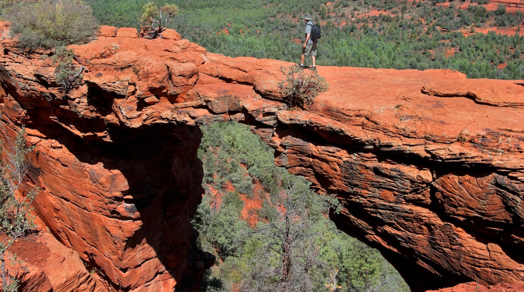 Man hiking at Devils Bridge in Sedona Arizona