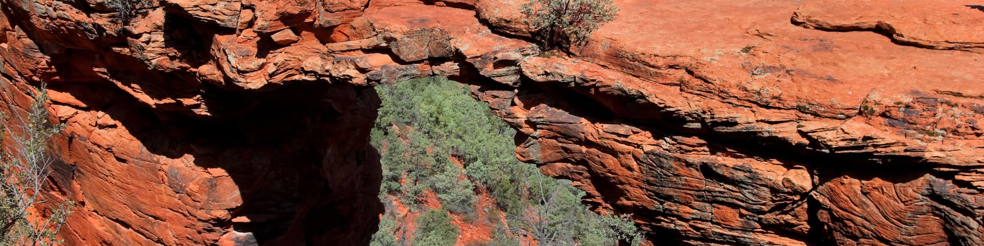 Man hiking at Devils Bridge in Sedona Arizona