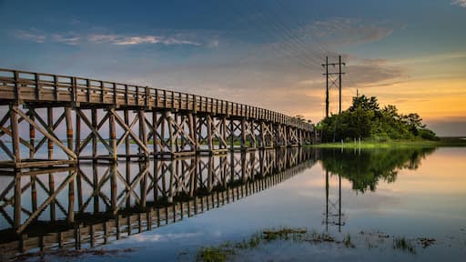 Placid sunrise next to a wooden trestle
