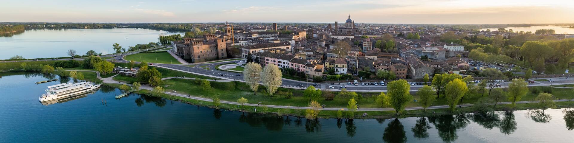 Aerial view into land of Castello di San Giorgio and cityscape at sunset, Mantua, Lombardy, Italy