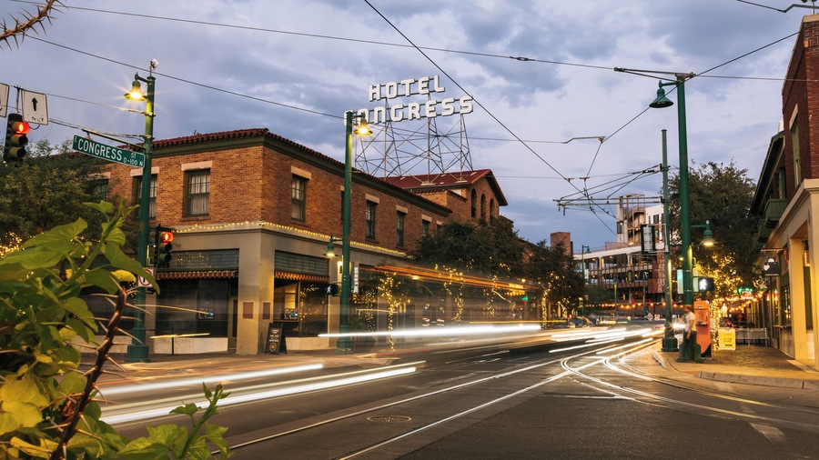A street with a hotel named 'Hotel Congress' and a street sign for 'Congress St.'