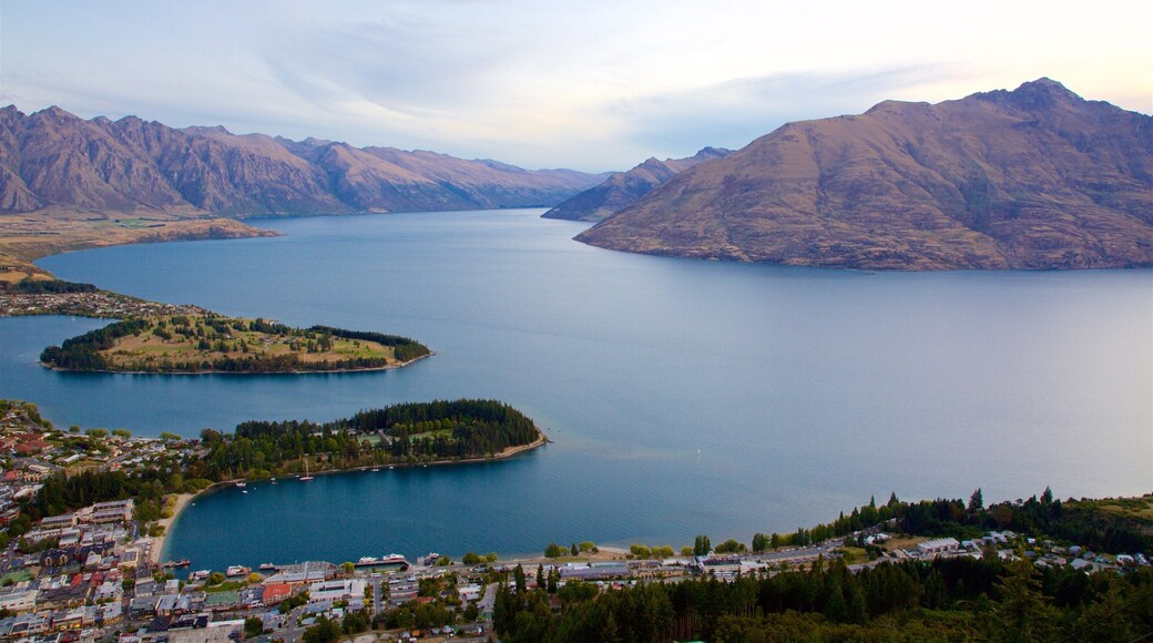 Cecil Peak featuring a small town or village, mountains and a sunset
