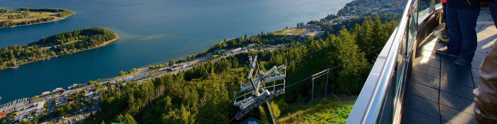 Cecil Peak which includes a bay or harbor, views and mountains