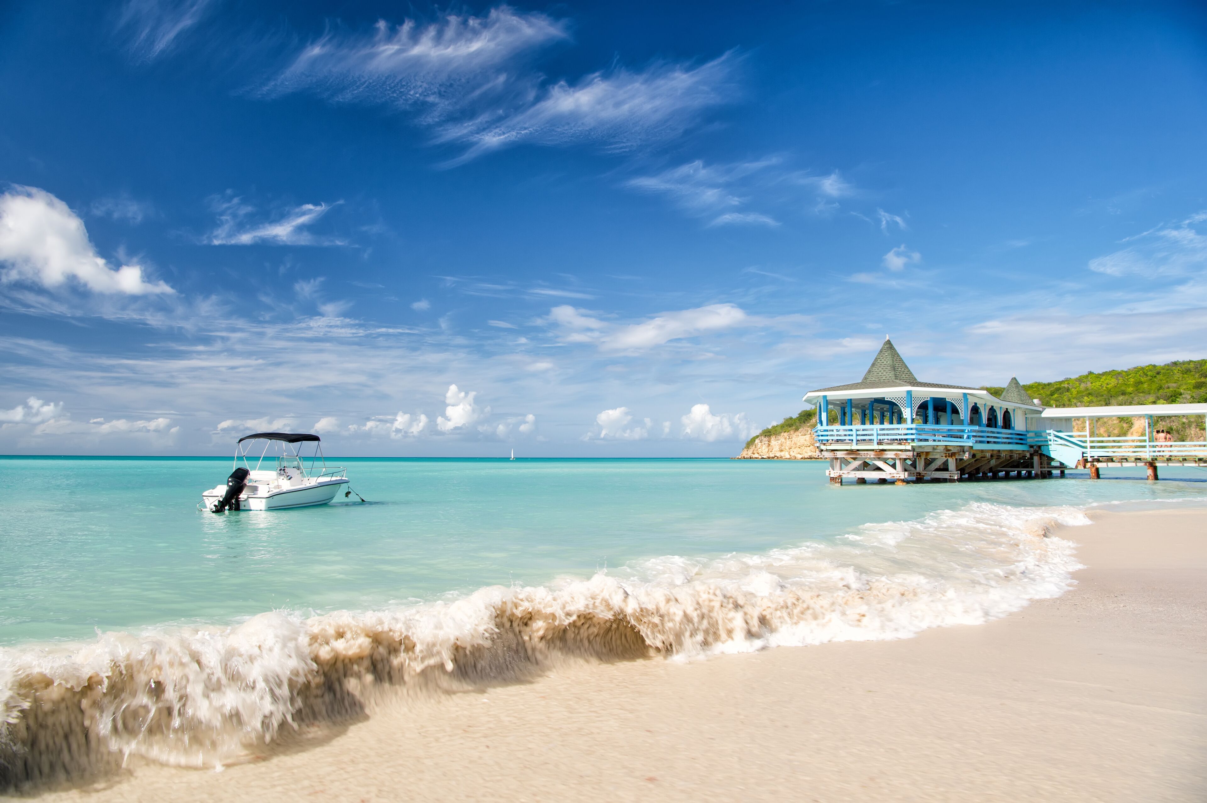 motorboat, yacht on water, cafe in St. John, Antigua bay