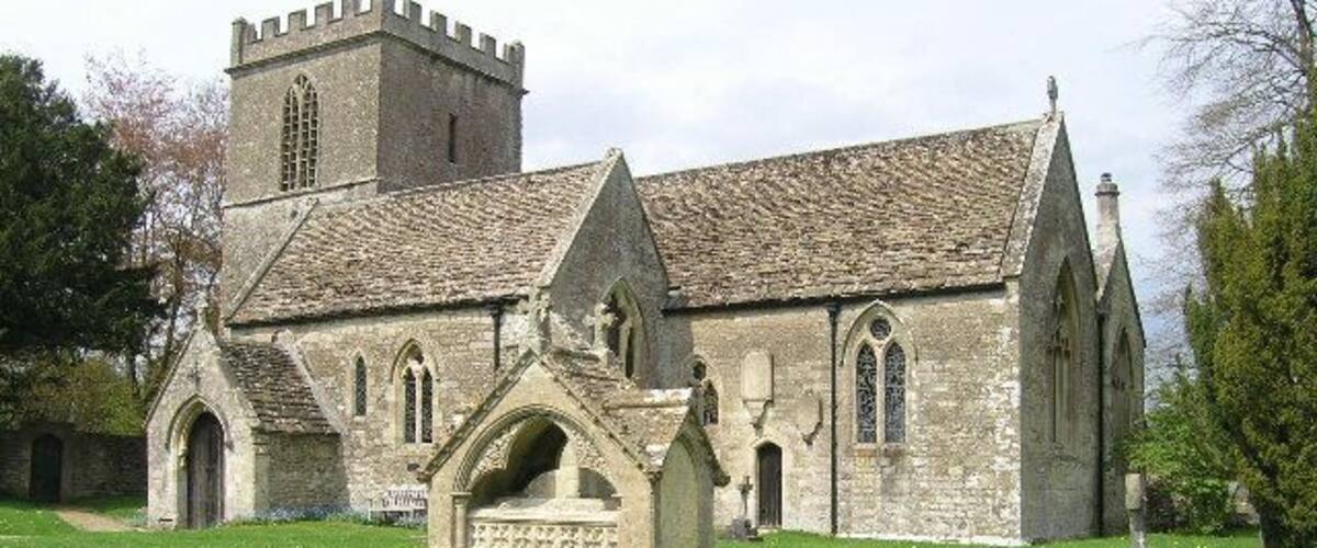 A historic church with a tower and arched windows.