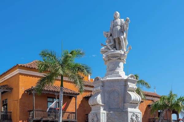 A statue of Christopher Columbus stands at the edge of Plaza de la Aduana, the largest and oldest square in the Old City of Cartagena. Colombia is named after Christopher Columbus, even though he never set foot on Colombian soil.