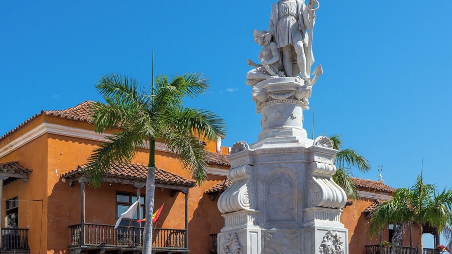 A statue of Christopher Columbus stands at the edge of Plaza de la Aduana, the largest and oldest square in the Old City of Cartagena. Colombia is named after Christopher Columbus, even though he never set foot on Colombian soil.