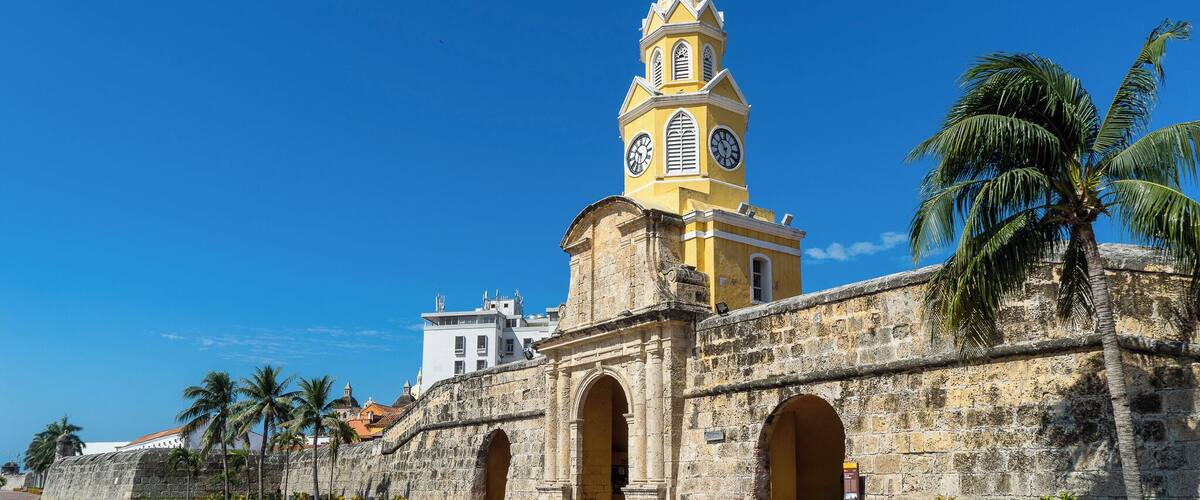 The Clock Tower, or "Torre de Reloj", is the main city gate of the historic center of Cartagena. Originally known as Boca del Puente (The Mouth of the Bridge), this entrance to the fortified city once utilized a drawbridge to cross the surrounding moat.
A pendulum clock was added in 1871, and replaced with a more superior Swiss clock in 1934 which is still in operation to the present day.