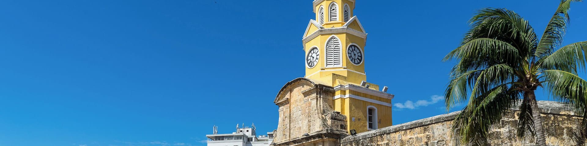 The Clock Tower, or "Torre de Reloj", is the main city gate of the historic center of Cartagena. Originally known as Boca del Puente (The Mouth of the Bridge), this entrance to the fortified city once utilized a drawbridge to cross the surrounding moat.
A pendulum clock was added in 1871, and replaced with a more superior Swiss clock in 1934 which is still in operation to the present day.