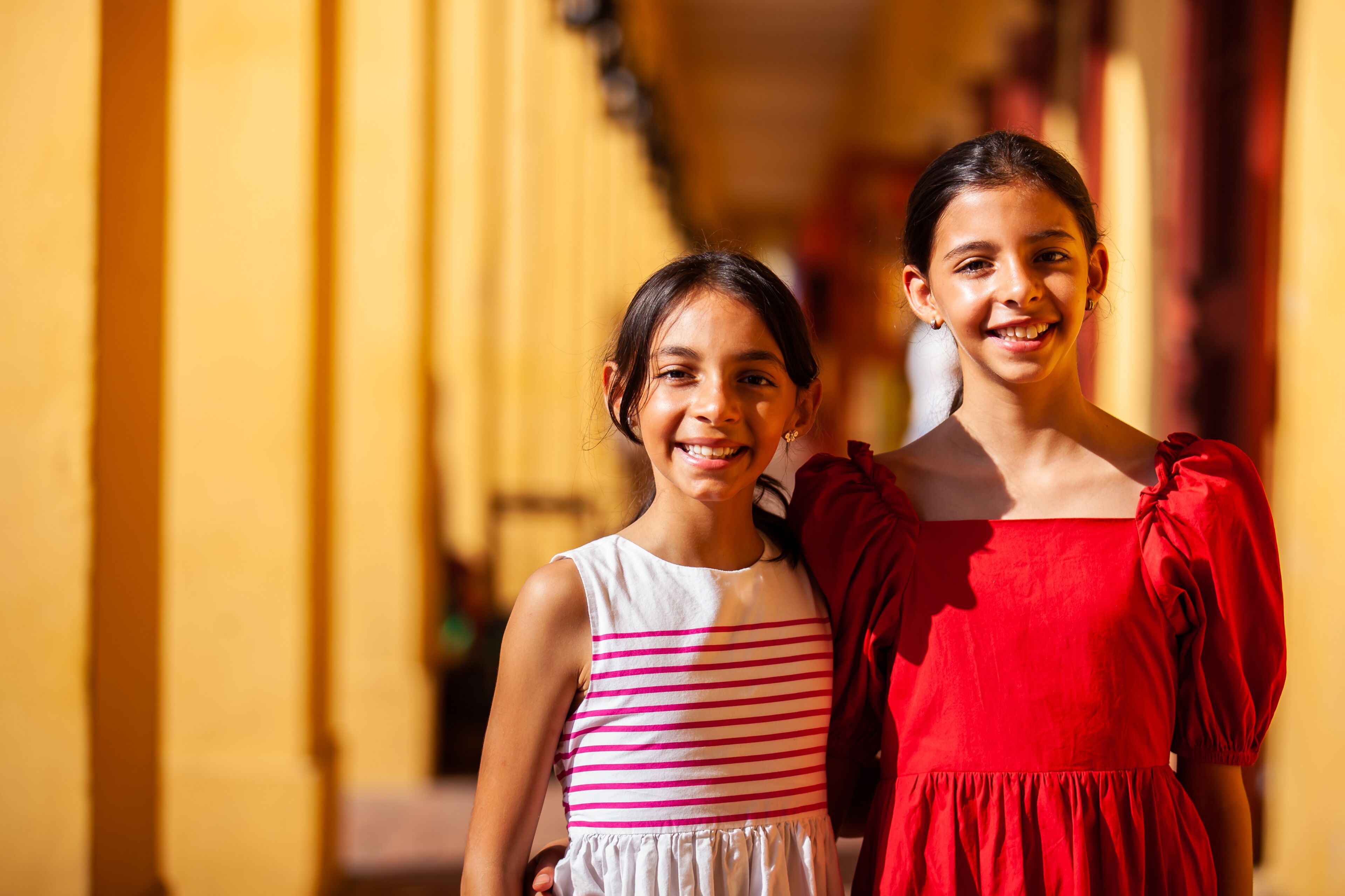 Beautiful young girls tourist in Cartagena de Indias. Colombian people. Travel concept. Real sisters.