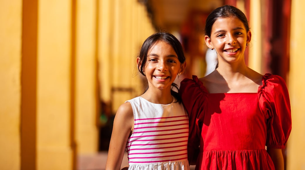 Beautiful young girls tourist in Cartagena de Indias. Colombian people. Travel concept. Real sisters.