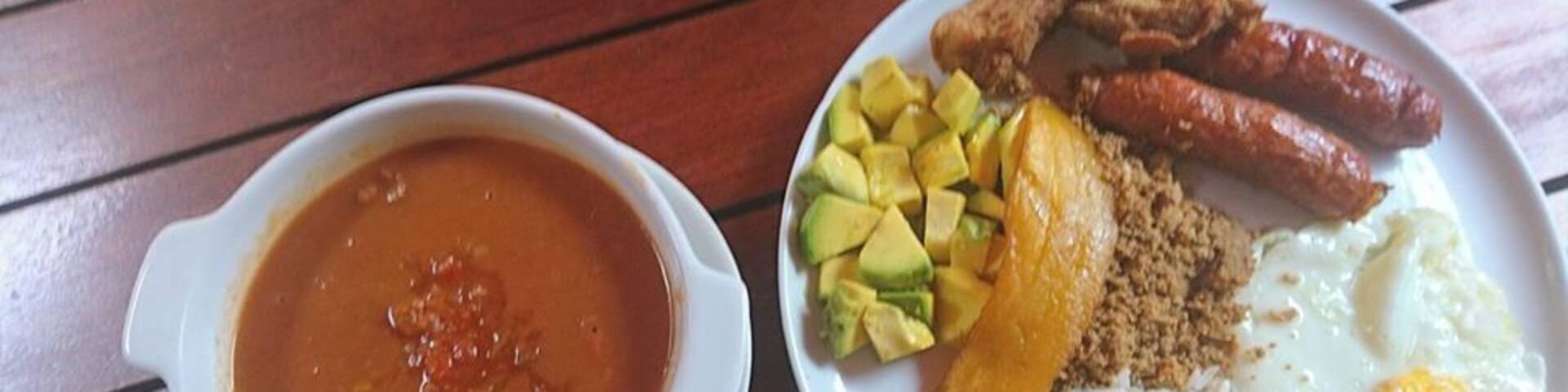 Just inside the entrance to Medellin's botanical gardens you can get the regional specialty, bandeja paisa. While this traditional meal can be found all over the region, this spot in the garden's cafe is a great urban oasis where you'll hear more birds than buses.
What is a bandeja paisa? It's sausage, ground meat, chicharon, fried egg, bean soup, plantain, avocado, and rice. I don't think anyone leaves hungry.
#GoodEats