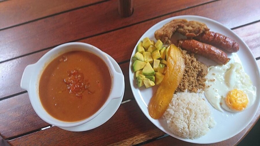 Just inside the entrance to Medellin's botanical gardens you can get the regional specialty, bandeja paisa. While this traditional meal can be found all over the region, this spot in the garden's cafe is a great urban oasis where you'll hear more birds than buses.
What is a bandeja paisa? It's sausage, ground meat, chicharon, fried egg, bean soup, plantain, avocado, and rice. I don't think anyone leaves hungry.
#GoodEats
