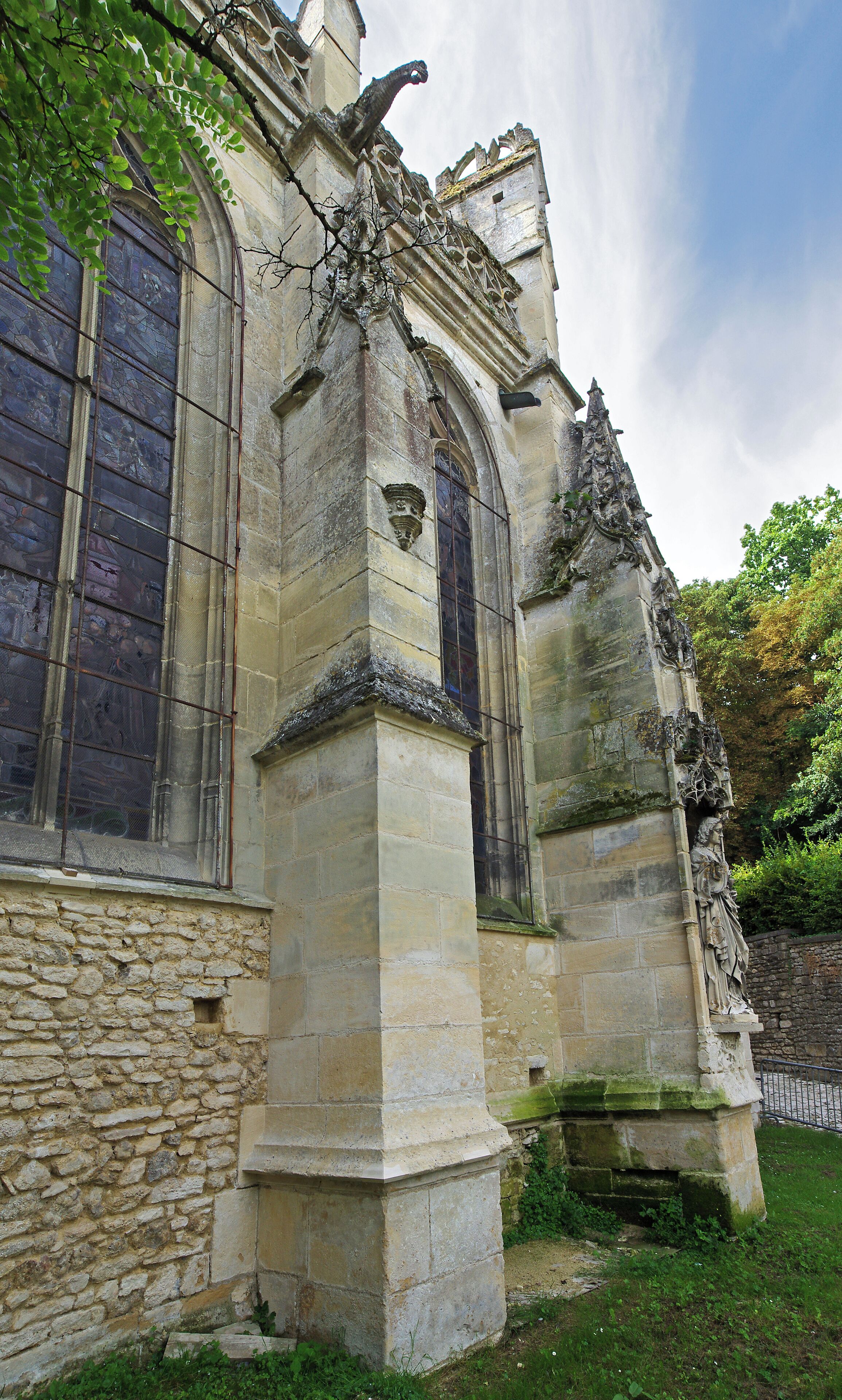 A historic stone building with arched windows and intricate carvings.
