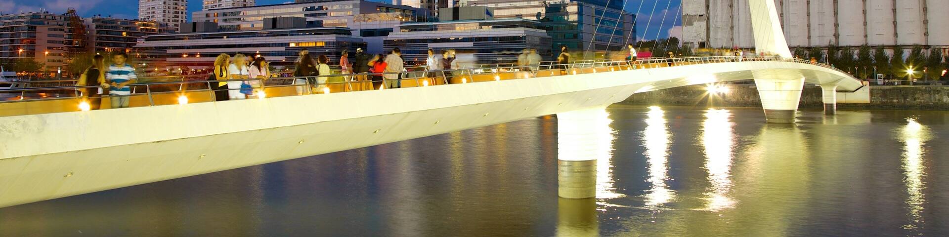 Puerto Madero which includes night scenes, a bridge and a river or creek