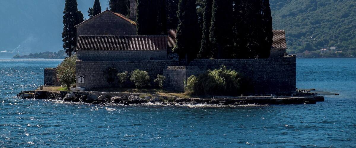 The Island of Saint George (Sveti Đorđe) is a natural islet off the coast of Perast in the Bay of Kotor, Montenegro. The island contains Saint George Benedictine monastery from the 12th century and the old graveyard.