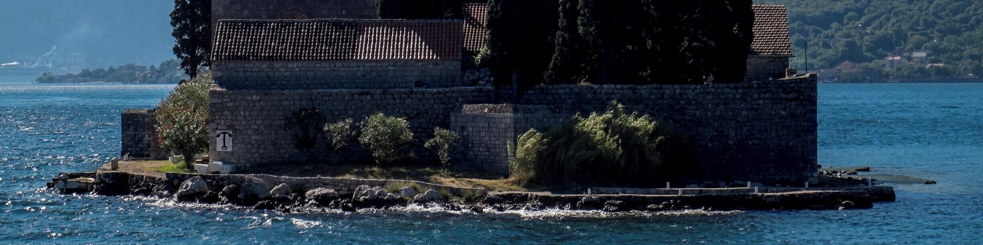 The Island of Saint George (Sveti Đorđe) is a natural islet off the coast of Perast in the Bay of Kotor, Montenegro. The island contains Saint George Benedictine monastery from the 12th century and the old graveyard.