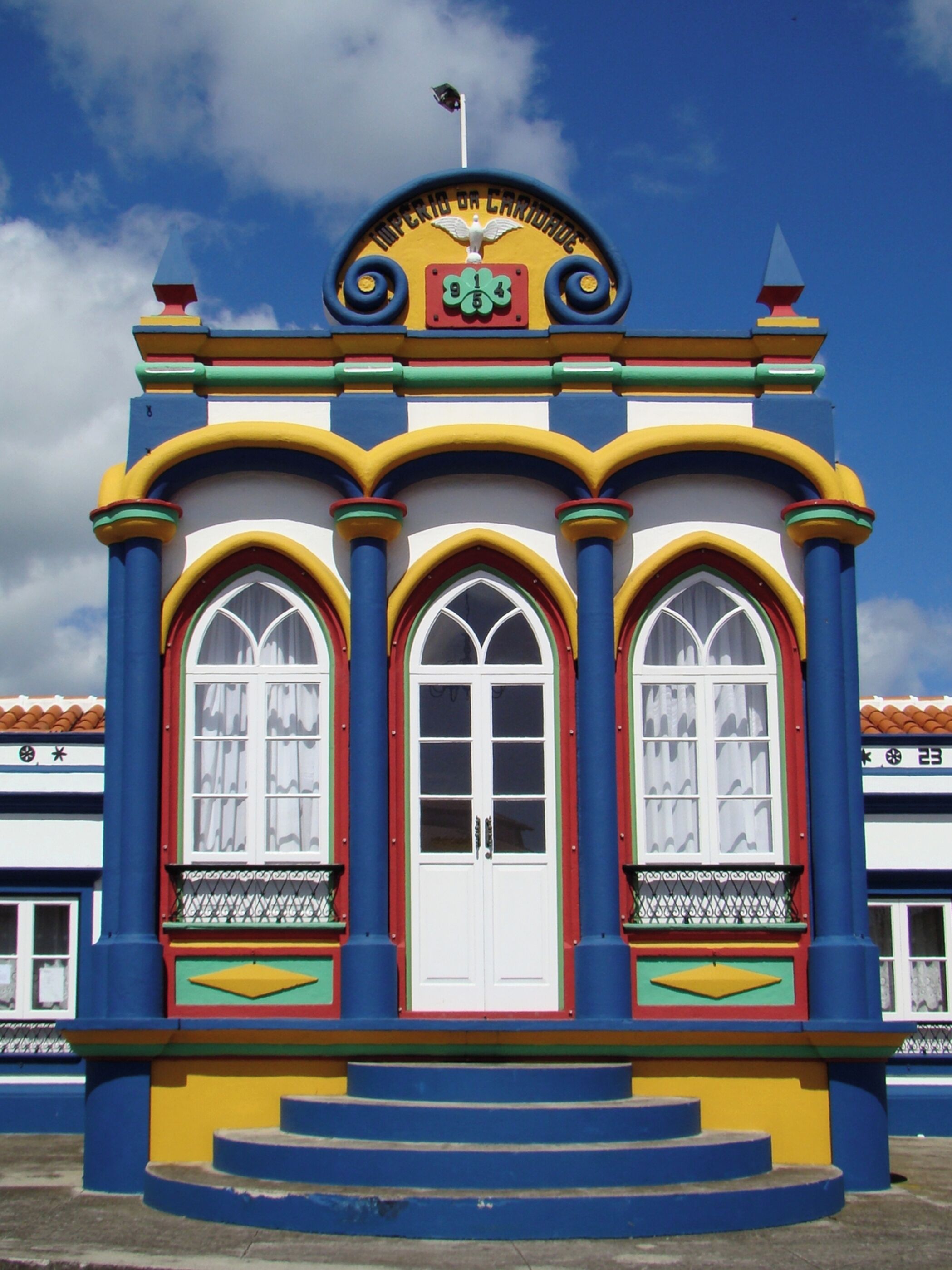 #Culture #Imperio #Azores #Acores #IlhaTerceira

Impérios da Ilha Terceira - Açores

As Festas do Espírito Santo estão presentes em todo o arquipélago dos Açores. São, no entanto, particularmente marcantes na Ilha Terceira. Este culto é celebrado no Domingo de Pentecostes e no Domingo da Trindade, que são, respectivamente o sétimo e oitavo domingos depois da Páscoa. As cerimônias se realizam em pequenas capelas chamadas de Impérios. A arquitetura dos Impérios varia desde uma capela simples até capelas vistosamente coloridas e ornamentadas. Na Ilha Terceira, quase todos os Impérios têm no topo a coroa imperial encimada por uma pomba representando o Espírito Santo.

Estive na Ilha Terceira durante dois dias. Com pouco tempo e condições atmosféricas nem sempre favoráveis consegui fotografar 21 dos 72 Impérios que existem na ilha.

Empires of Terceira Island - Azores

The Feasts of the Holy Spirit are present throughout the archipelago of the Azores. They are, however, particularly striking on Terceira Island. This worship is celebrated on Pentecost Sunday and Trinity Sunday, which are respectively the seventh and eighth Sundays after Easter. The ceremonies take place in small chapels called Empires. The architecture of the empires ranges from a simple chapel to visually colorful and ornate chapels. In Terceira Island, almost all the Empires have at the top the imperial crown surmounted by a dove representing the Holy Spirit.

I was on Terceira Island for two days. With little time and atmospheric conditions not always favorable I was able to photograph 21 of the 72 Empires that exist on the island.