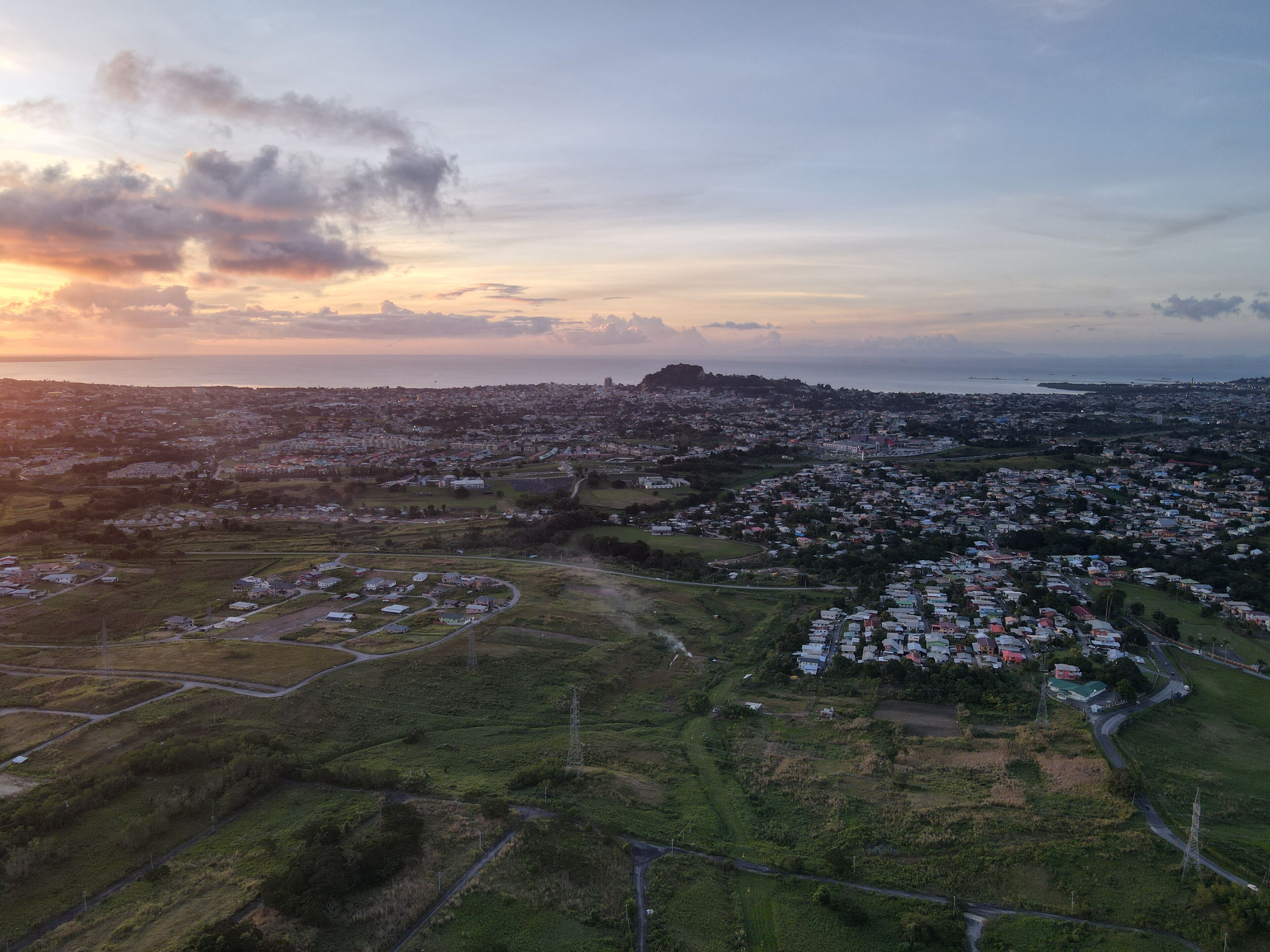 Aerial view of the cityscape of San Fernando against the dusk sky at sunset in Trinidad and Tobago