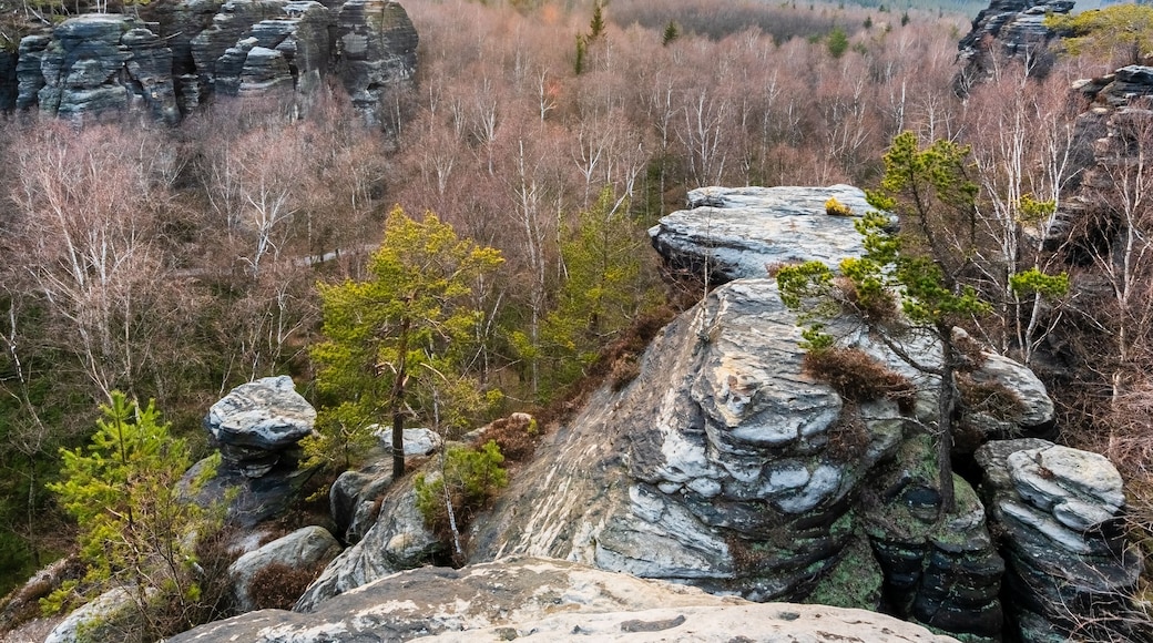 A rocky landscape with a sunset in the background.