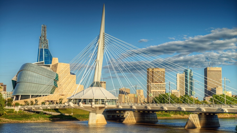 Winnipeg which includes a bridge, a river or creek and modern architecture