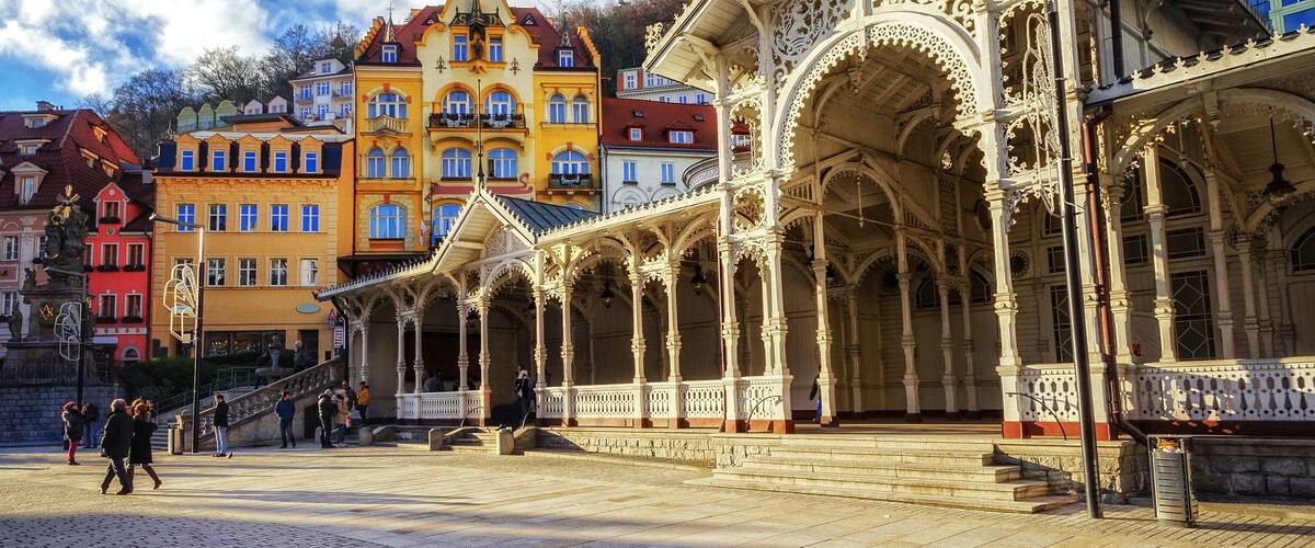 A historic building with ornate architecture and a vibrant, colorful backdrop.