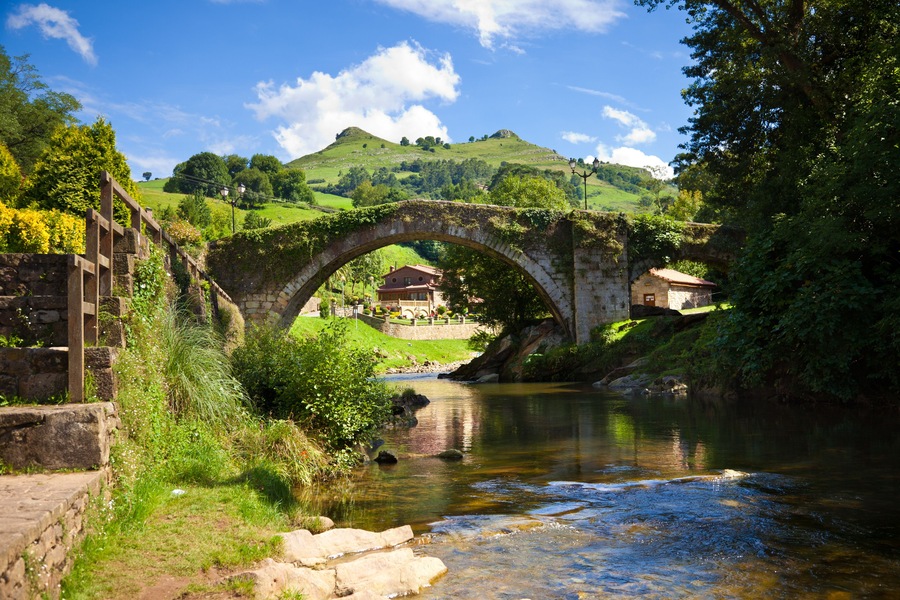 Old bridge over Miera river in Lierganes town. Cantabria, Spain