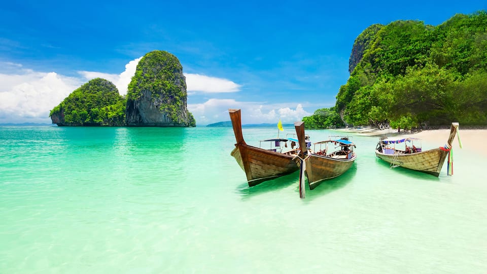 Beauty beach and limestone rocks, focus on the boats