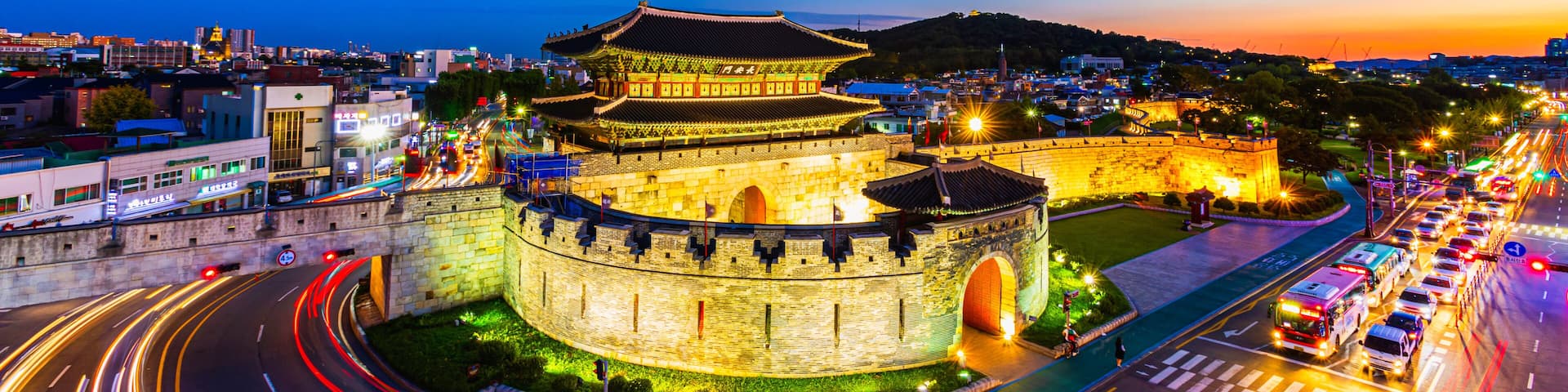 Suwon,South Korea-September 16,2019:Sunset and Beautiful Old Architecture and Traffic of Changanmun Gate Hwaseong Fortress in Suwon,South Korea