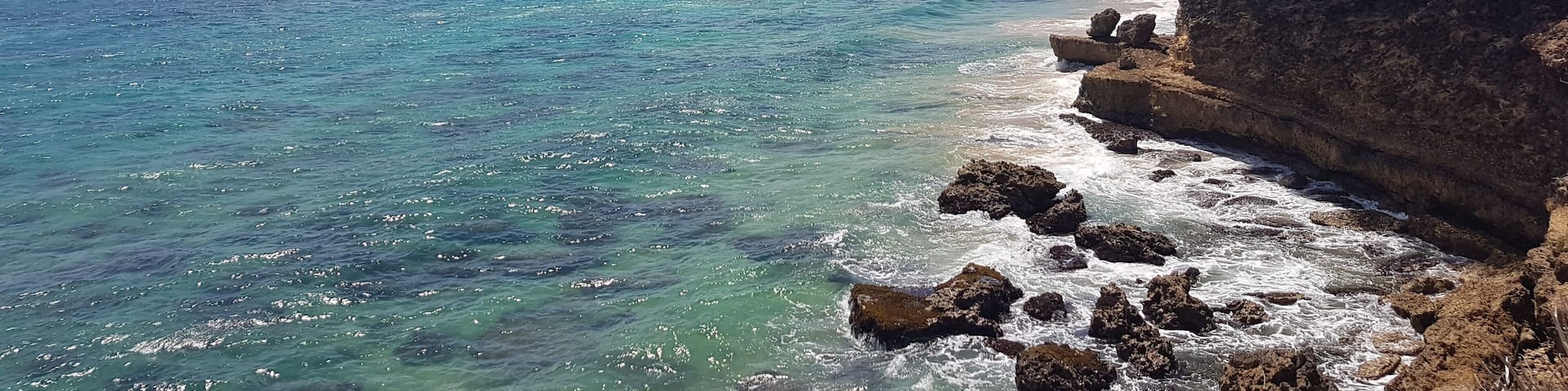 View from the top of the coast line: further the Grange beach and Mount Irvine beach.