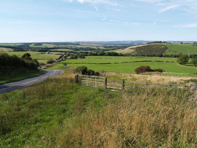 Farmland North of Whittonstall and B6309 Farmland North of Whittonstall Also showing the Roman road of Dere Street (B6309) stretching north towards the Tyne Valley in the far distance. The hamlet of Apperley Fell is visible to right hand side middle horizon.