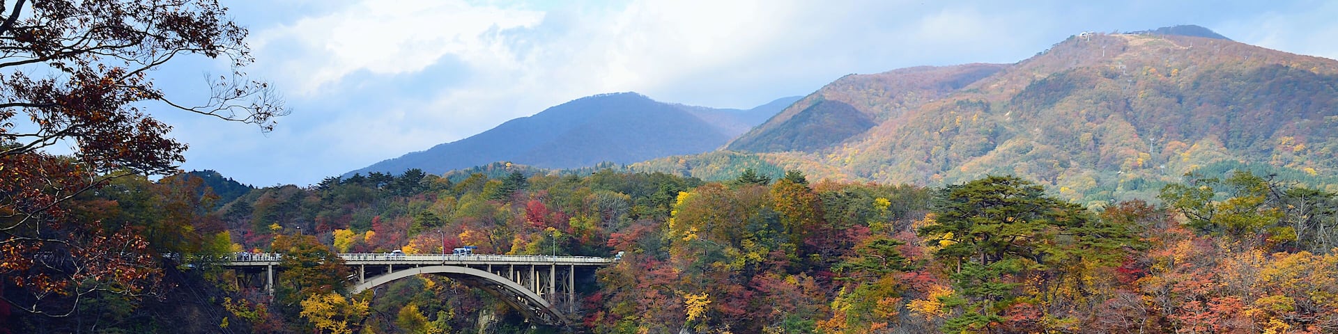 Ofukazawa Bridge spanning across Naruko Gorge with colorful in the autumn Season of Japan.