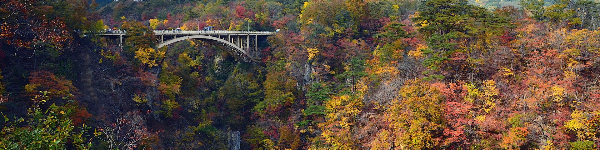 Ofukazawa Bridge spanning across Naruko Gorge with colorful in the autumn Season of Japan.
